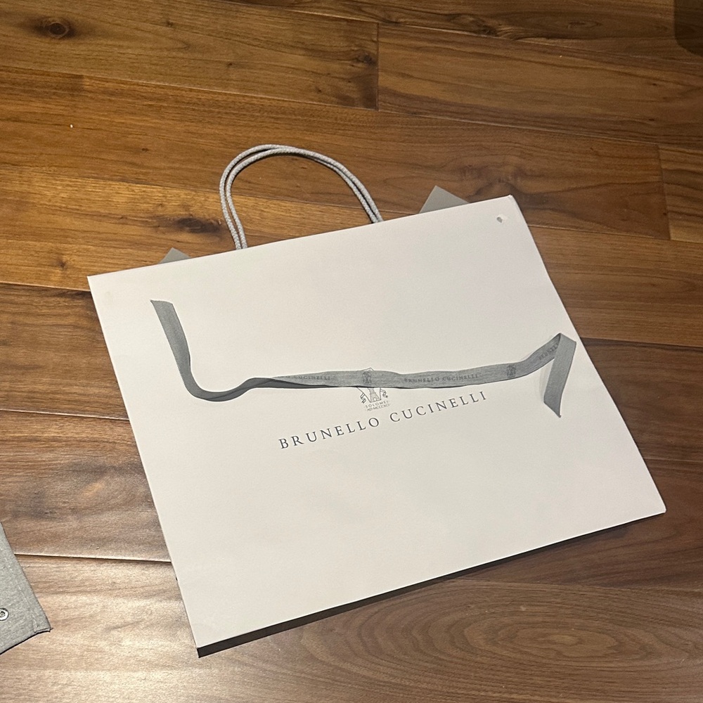 Brunello Cucinelli Cream large paper Bag with Gray Accents. Comes with ribbon.